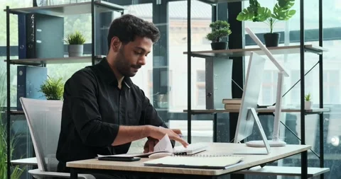 Middle Eastern Man at Work with papers in the Office Stock Footage 254511588