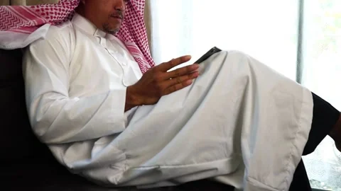 Middle eastern man working from his home Stock Footage 229475744