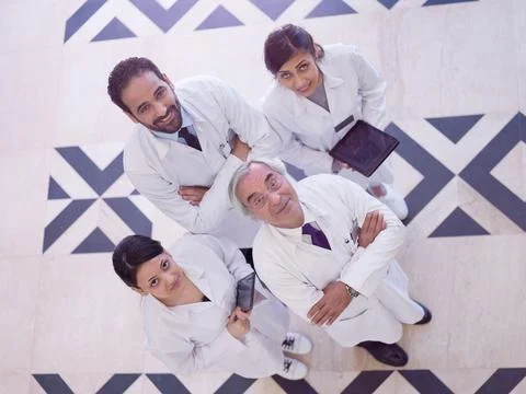 Middle Eastern medical team of doctors in hospital clinic smiling and Stock Photos