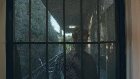 Middle eastern millennial opens apartment security door and looks into unit Video stock 89233531