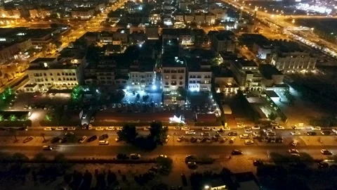 Middle Eastern night street drone shot Stock Footage 207790366
