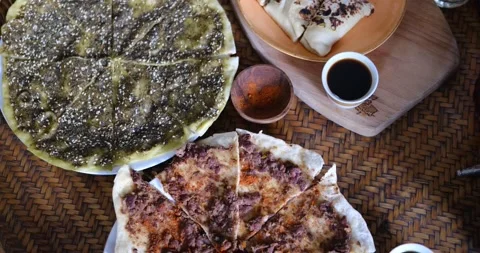 Middle eastern or arabic dishes and assorted meze: hummus, pita, Manakish Lahm Stock-Footage 151471097