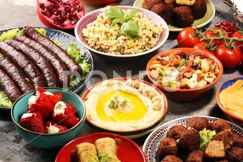 Middle eastern or arabic dishes and assorted meze, concrete rustic background Stock Photos