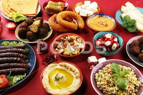 Middle eastern or arabic dishes and assorted meze, concrete rustic background Stock Photos