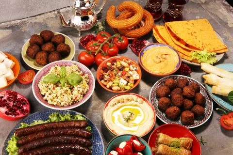 Middle eastern or arabic dishes and assorted meze, concrete rustic background Stock Photos