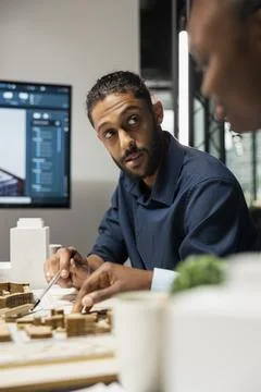 Middle eastern real estate developer presenting idea of residential layout Stock Photos