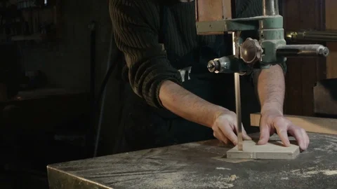 Middle field on a carpenter who cuts a piece of wood with a band saw Stock Footage 88812596