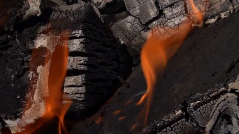 In the middle of fire. Flame and smoke waving against burnt firewoods. Slow-mo Vídeos de archivo 98740089