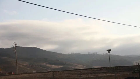 Middle of nowhere intersection, telephone polls Stock Footage 109171077