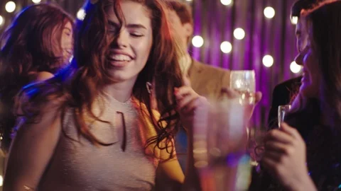 In the middle of the party young people dancing drinking champagne feeling happy Stock Footage 122045305