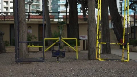 Middle plan on a deserted wind platform swing swinging swings a swing painted in Stock Footage 197285837