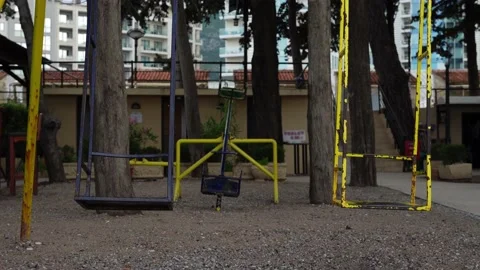 Middle plan on a deserted wind platform swing swinging swings a swing painted in Stock Footage 197285889
