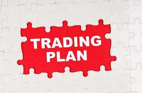 In the middle of the puzzles on a red background it is written - TRADING PLAN Stock Photos