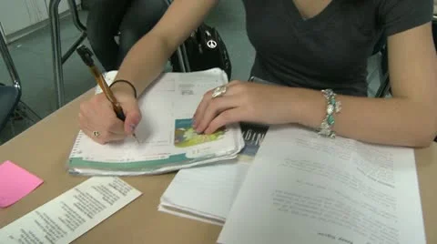 Middle school student writing in notebook Stock Footage 8978077