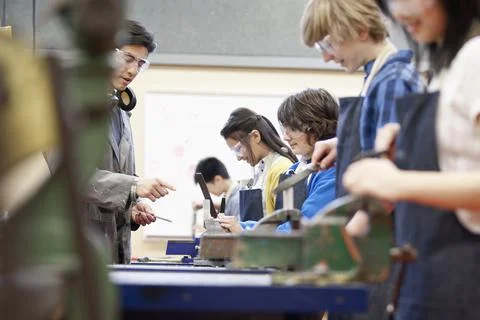 Middle school students in machine shop class Stock Photos