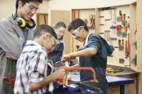 Middle school students in machine shop class Stock Photos