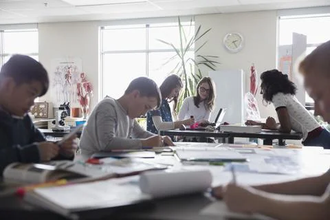 Middle school students working on science project in classroom Stock Photos