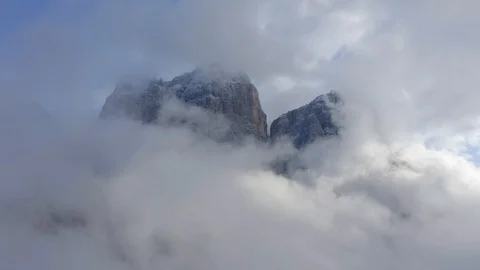In the middle of a sea of clouds a glimpse of the Monte Pelmo Stock Footage 129812504