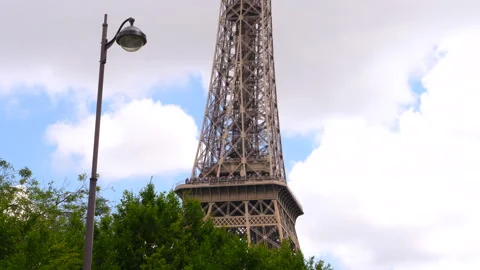 The middle section of the Eiffel Tower in Paris, France, with street lamp Stock Footage 260695673