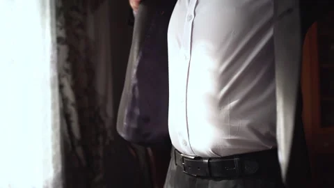 Middle shot of man getting ready for an important event. Groom preparing for the Stock Footage 148736446