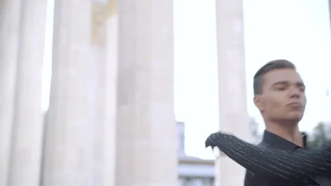 Middle shot of skilled slim young couple dancing ballet in sunrays in urban city Video stock 146960761