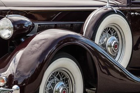 Middle view from a very old classic car with a spare tire during a car show Stock Photos