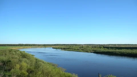 Midges fly on the background of the river and clear sky Stock Footage 108488375