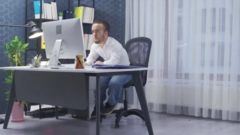 Midget man working in his office. Stock Footage 230978546