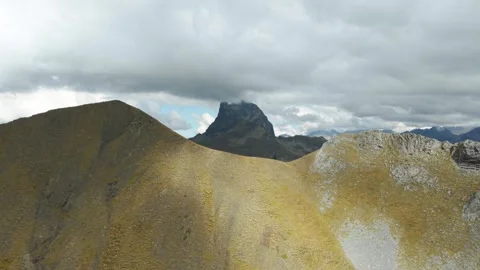 Midi d'Ossau Rising Beyond High Mountain Ridge in the Pyrenees Stock Footage 345043297