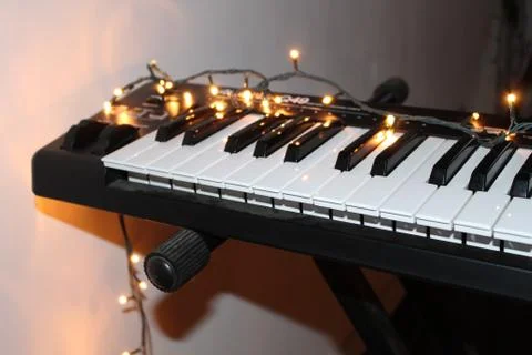 A Midi Keyboard With Lights On It Stock Photos