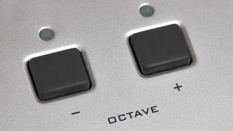 Midi Octave up down buttons close up or knobs octave max min. Stock Photos