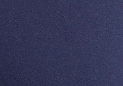 Midnight blue paper background with a smooth, matte surface and subtle grainy Stock Photos