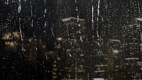 Midnight City Through a Rainy Window 4K Stock Footage 327233613