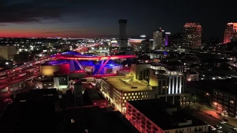 Midnight drone flight over downtown New Orleans Louisiana glowing skyline Stock Footage 344537485