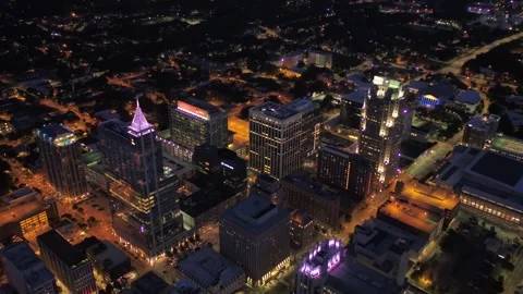 Midnight drone flight over downtown Raleigh North Carolina with bright lights Stock Footage 344641909