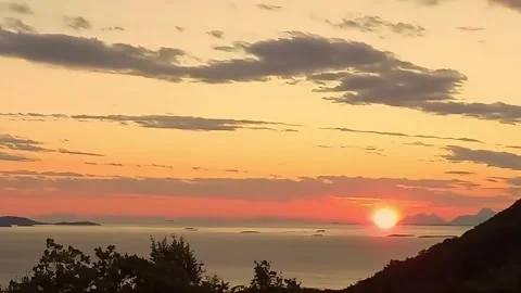 The midnight sun during which the sun never sets from Bodo, Norway Stock Footage 285783252