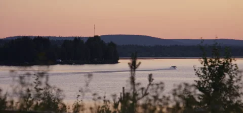 Midnight sun, mountain view and boats driving Stock Footage 325649395
