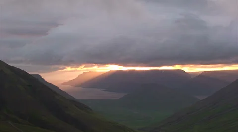 Midnight sunshine under cloud cover in fjords Stock Footage 37300798