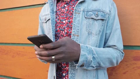 Midsection of african man using smartphone. Stock Footage 146551128