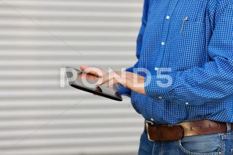 Midsection of architect using digital tablet Stock Photos