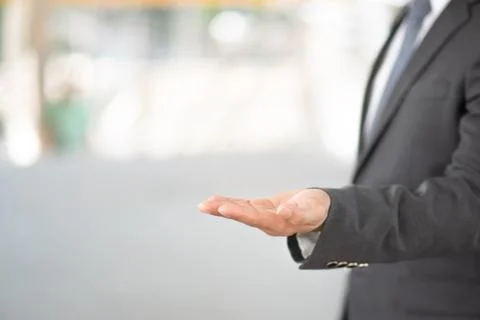 Midsection Of Businessman Gesturing In Office Stock Photos