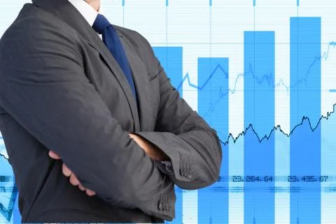 Midsection of businessman standing with graphs in background Stock Photos