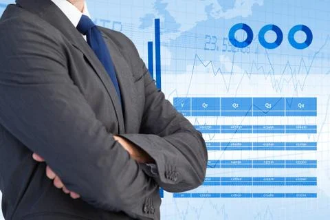 Midsection of businessman standing with graphs interface in background Stock Photos