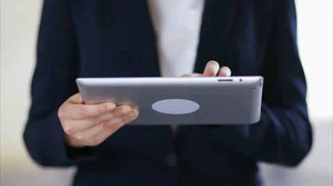 Midsection of businesswoman using digital tablet Stock Footage 55600988