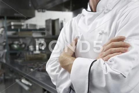 Midsection Of Chef With Arms Crossed Stock Photos