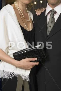 Midsection of a couple wearing formal attire Stock Photos