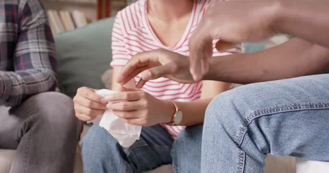 Midsection of diverse friends holding hands at group therapy, slow motion Stock Footage 245491198