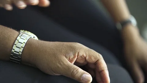 Midsection of female doctor holding hand of senior man while consoling in clinic Stock Footage