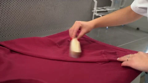 Midsection of female worker standing at workplace with professional dry cleaning Video stock 151648884