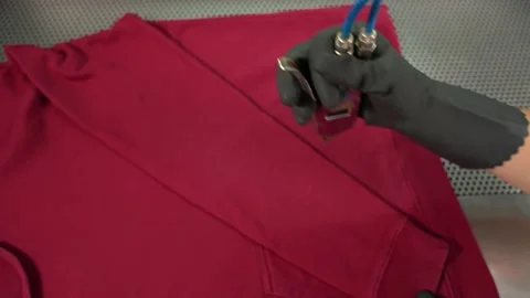 Midsection of female worker standing at workplace with professional dry cleaning Video stock 151648935